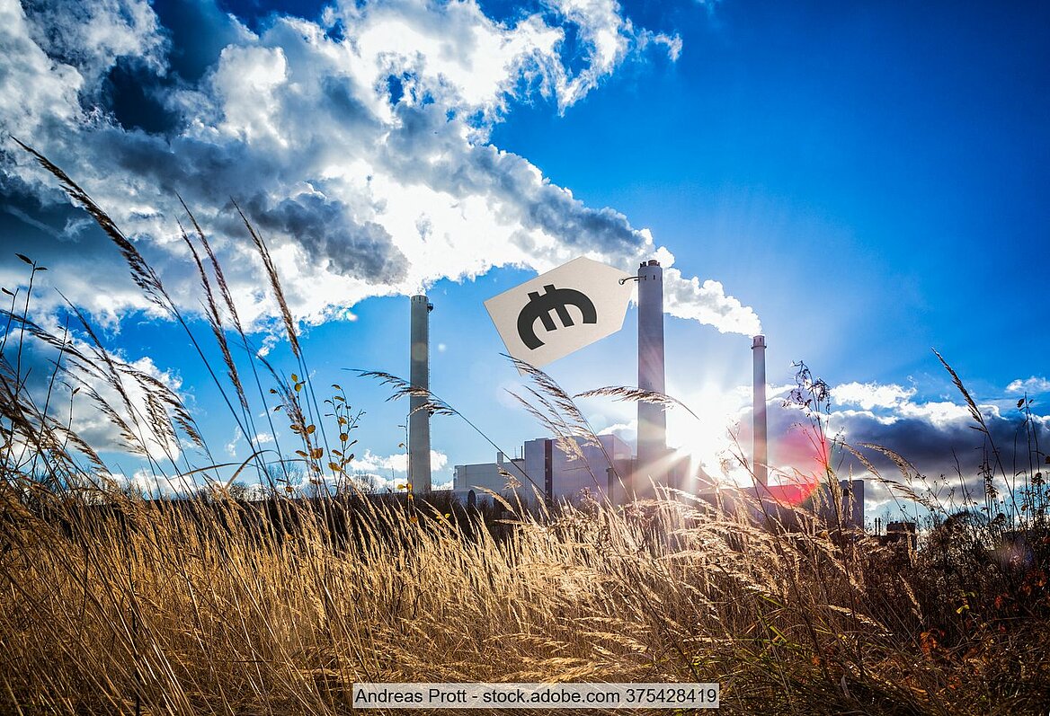 Stock image of a waste incineration facility with a price tag attached to one of its stacks