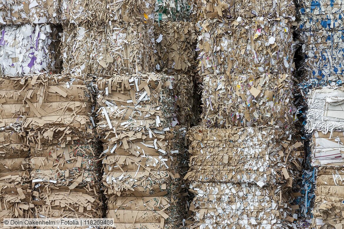 Stacked bales of recovered paper and board.
