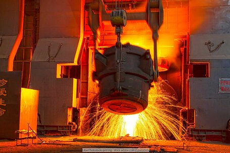 Molten steel being poured from a ladle