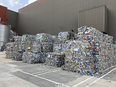 stacked bales of compressed beverage cartons in front of Essity's Hondouville plant in Northern France