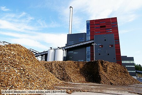 Heap of chipped waste wood stored next to a biomass power plant