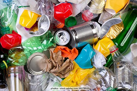 Mixed household packaging waste: food tins, crushed plastic bottles and yoghurt pots, plastic bags, aluminium trays, etc.
