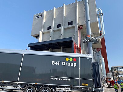 Exterior view of B+T Group's refuse-derived fuel (RDF) power plant in the Chalampé chemical park in the East of France, with a B+T HGV in front of it.