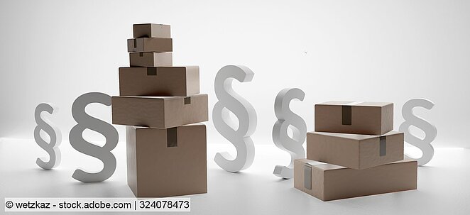 section signs stand amongst piled cardboard boxes (stock photo)