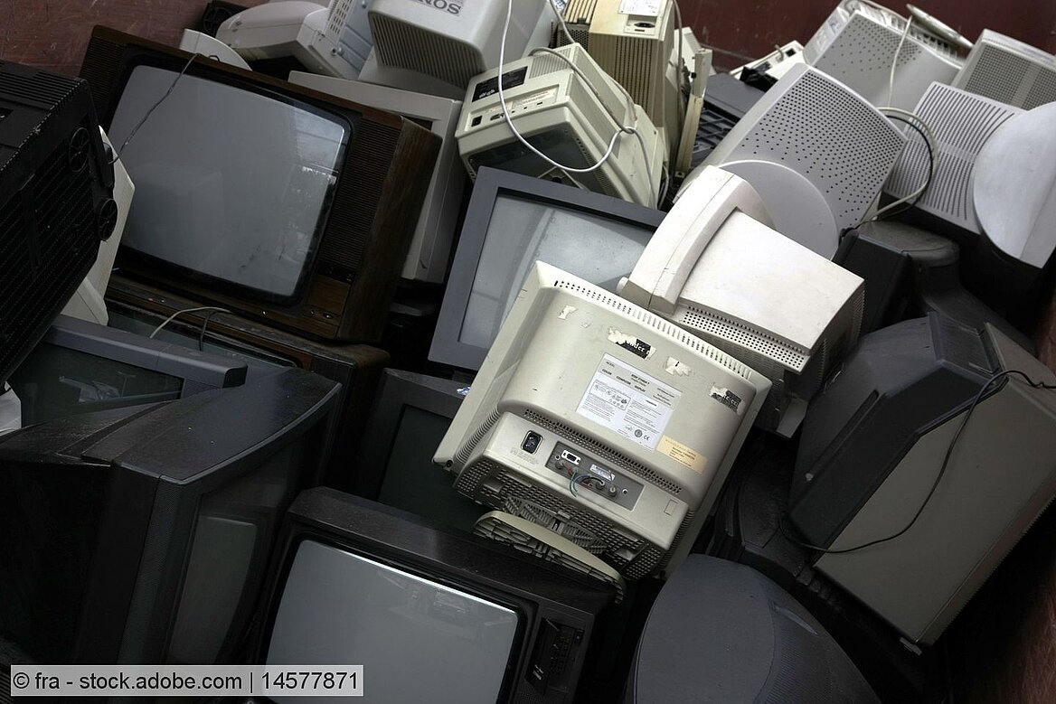 A pile of old TV sets and computer monitors with cathode ray tubes (CRT)