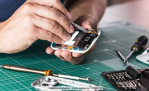 Stock photo of a smartphone being repaired