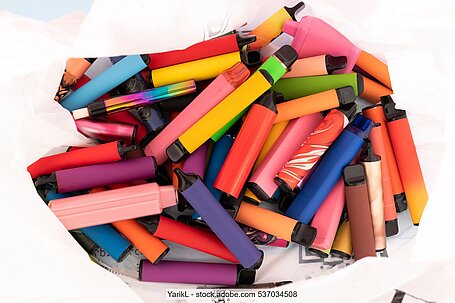 Bag full of discarded e-cigarettes in different colours (stock photo)
