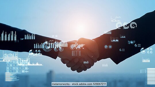 Stock photo of two businesspeople shaking hands