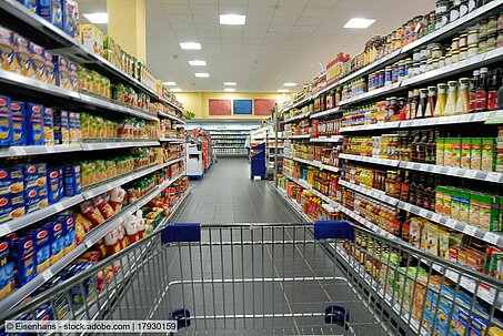 grocery store aisle with full shelves (stock photo)