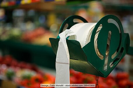 Thin-walled plastic bags for fruit and vegetables on a roll in a supermarket