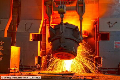 Ladle pours molten steel at a mill