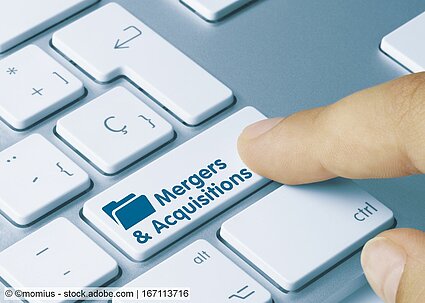 mergers and acquisitions representative image with keyboard