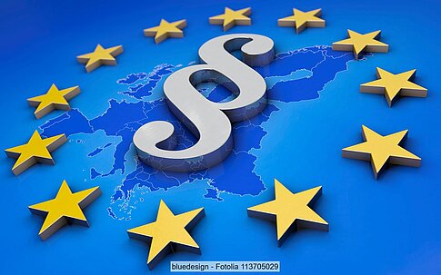 Symbol image: Paragraph sign on blue background surrounded by the EU star wreath