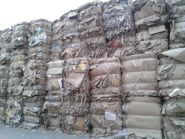 stacked bales of recovered paper