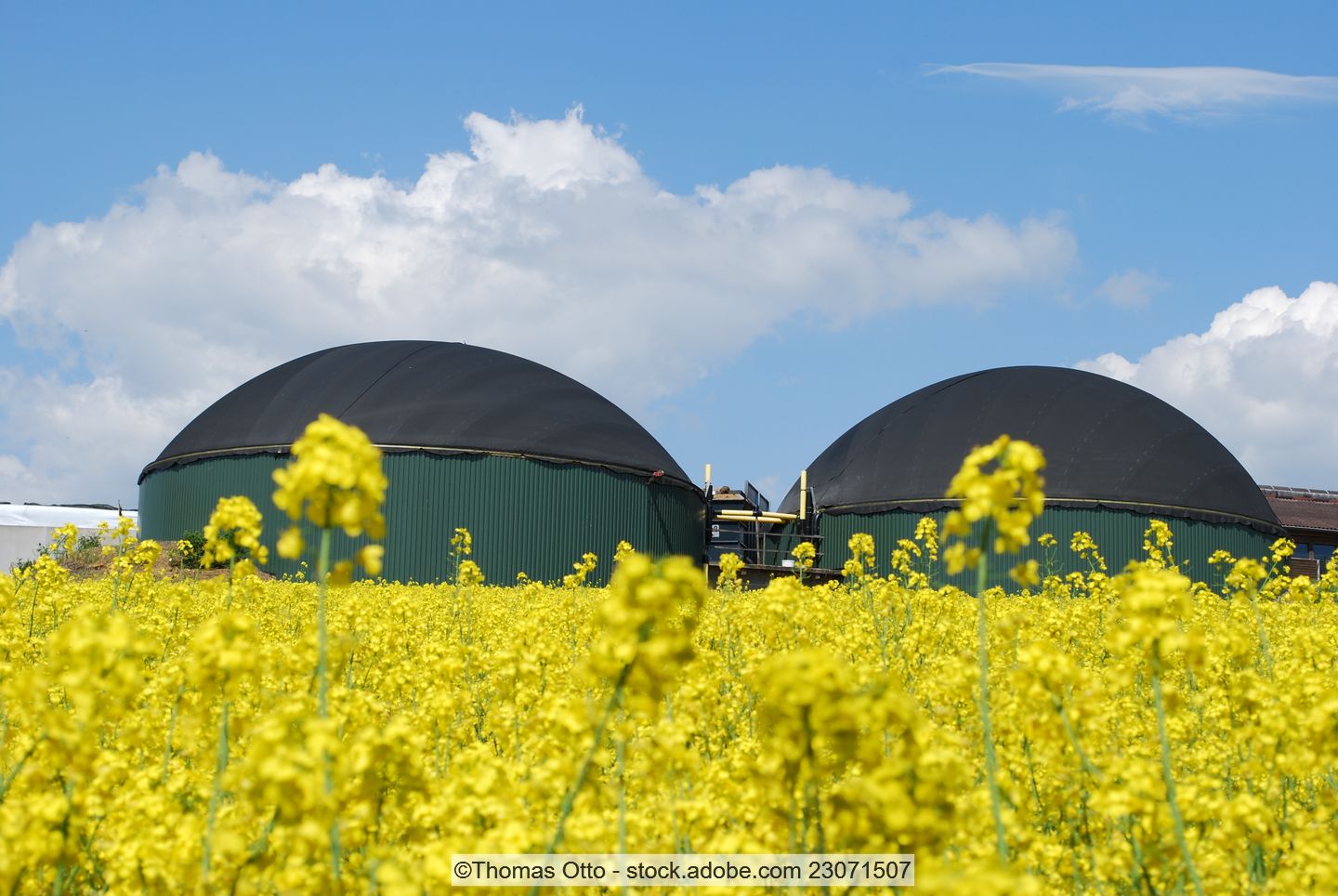 two biogas plants in a field