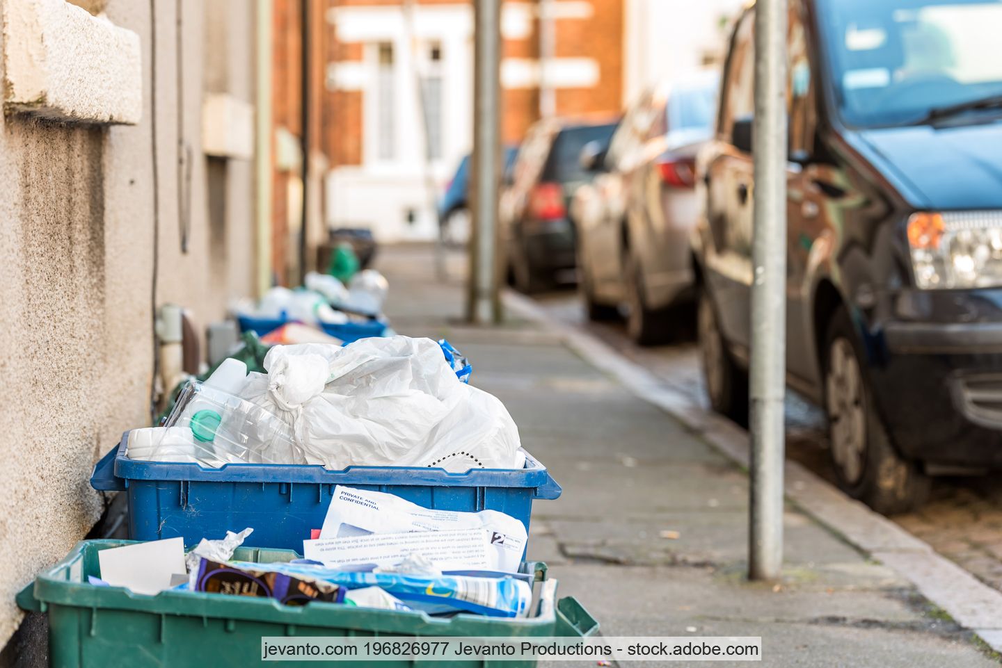 Bins for kerbside collections of recyclable materials set out on the pavement in the UK