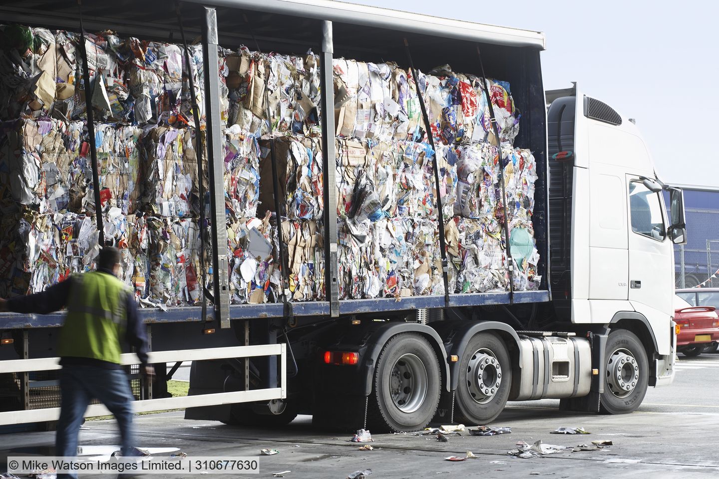 Stock photo of curtainsider lorry carrying baled waste.