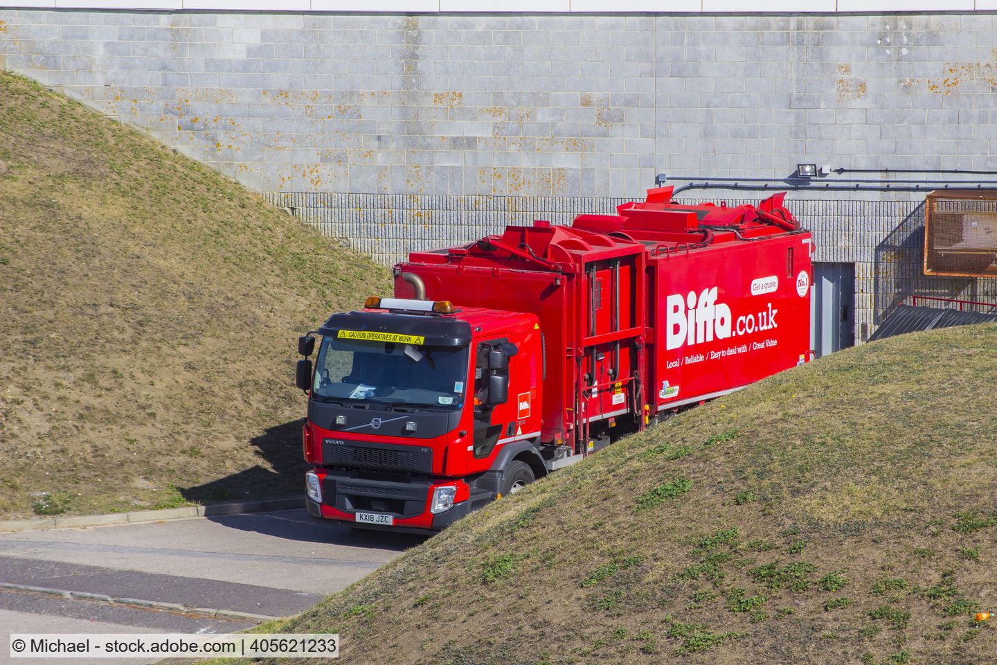 Waste lorry in red Biffa livery