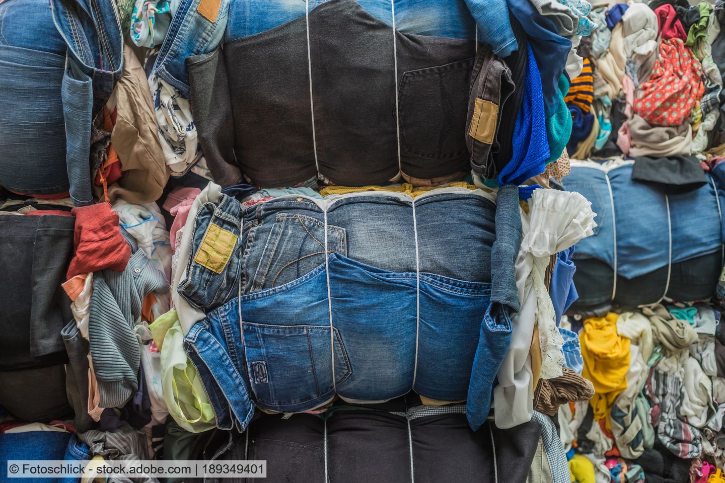 Photo of baled used textiles, including blue jeans and other apparel.