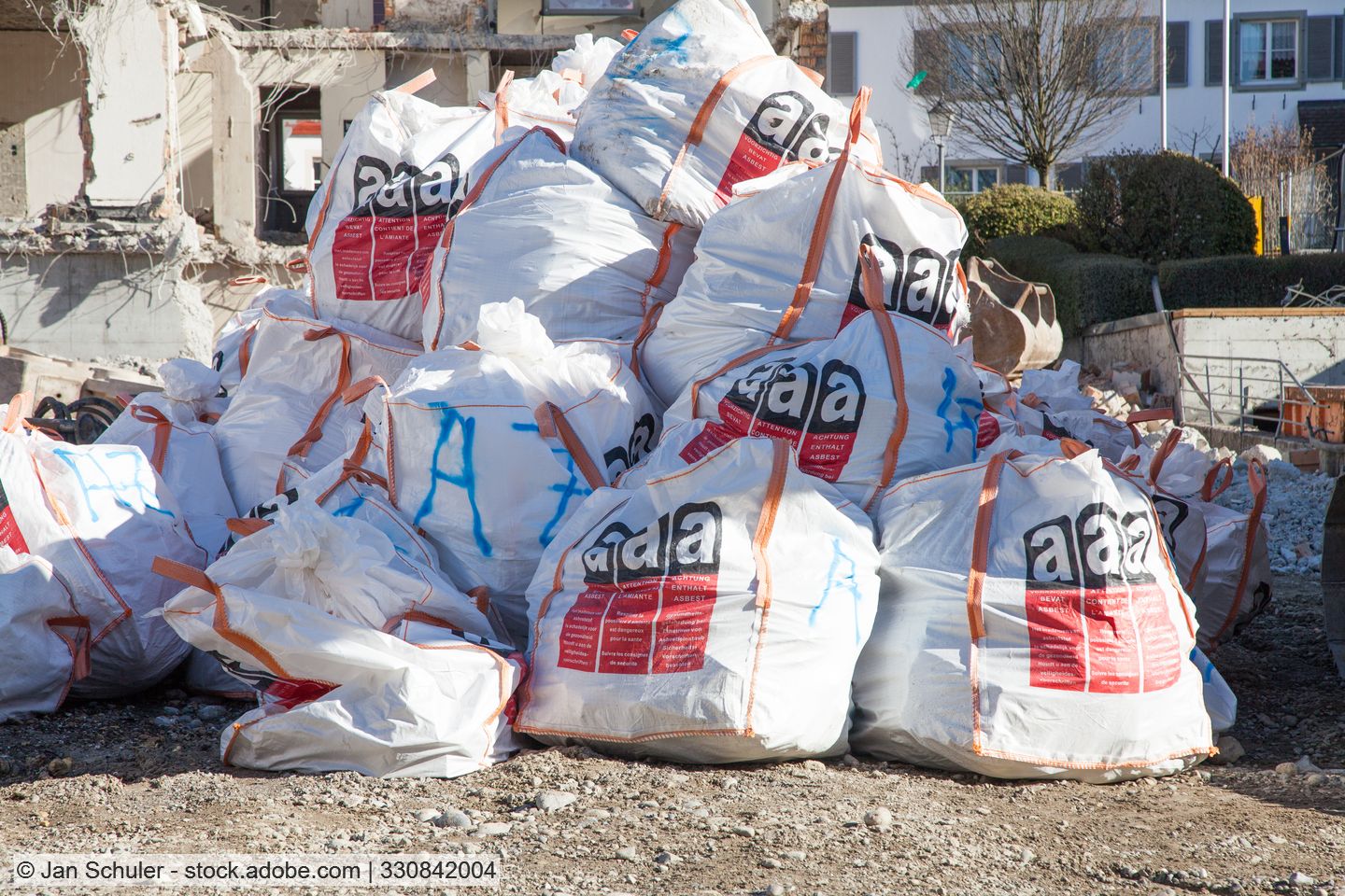 Pile of sealed bags containing asbestos waste